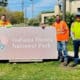 Site Services paving team next to the Indiana Dunes National Park sign