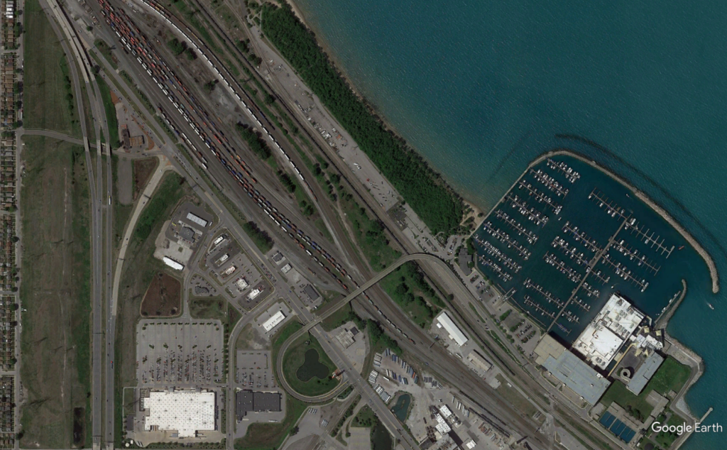 Site Services | A satellite image of a highway and a body of water.