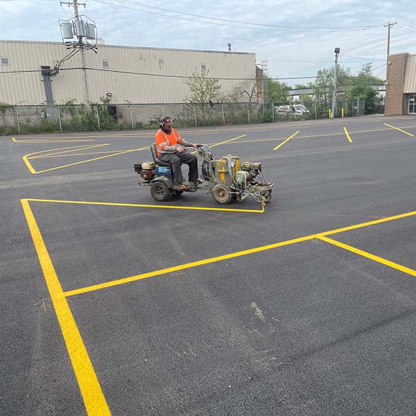 Site Services crew striping business parking lot