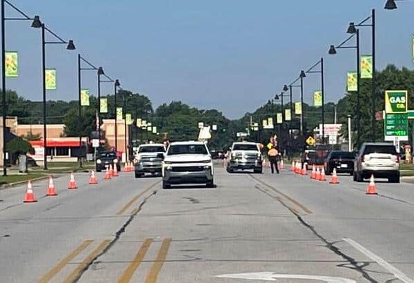 Site Services | A street in Portage, IN, is lined with cones during cracksealing project.